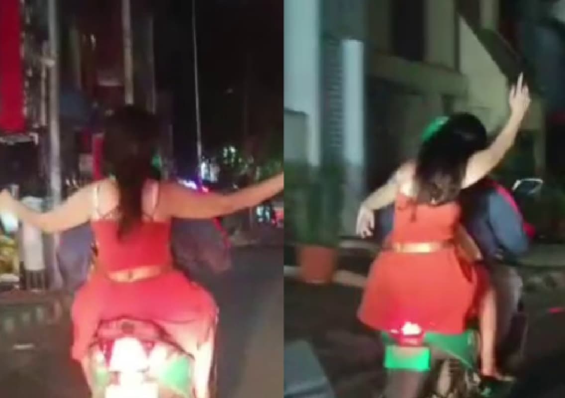 ಹೆಲ್ಮೆಟ್ ಧರಿಸದೇ, ಬಾಟಲ್ ಹಿಡಿದು ಸ್ಕೂಟಿಯಲ್ಲಿ ಯುವತಿ ಹುಚ್ಚಾಟ!