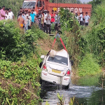 Udupi: Tourist's car falls into roadside lake after losing control