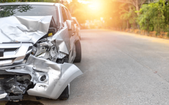 Woman critically injured after car collides with two-wheeler