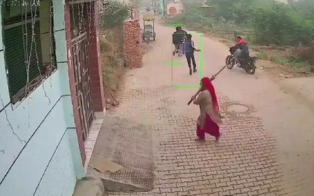 Woman hits man with broom
